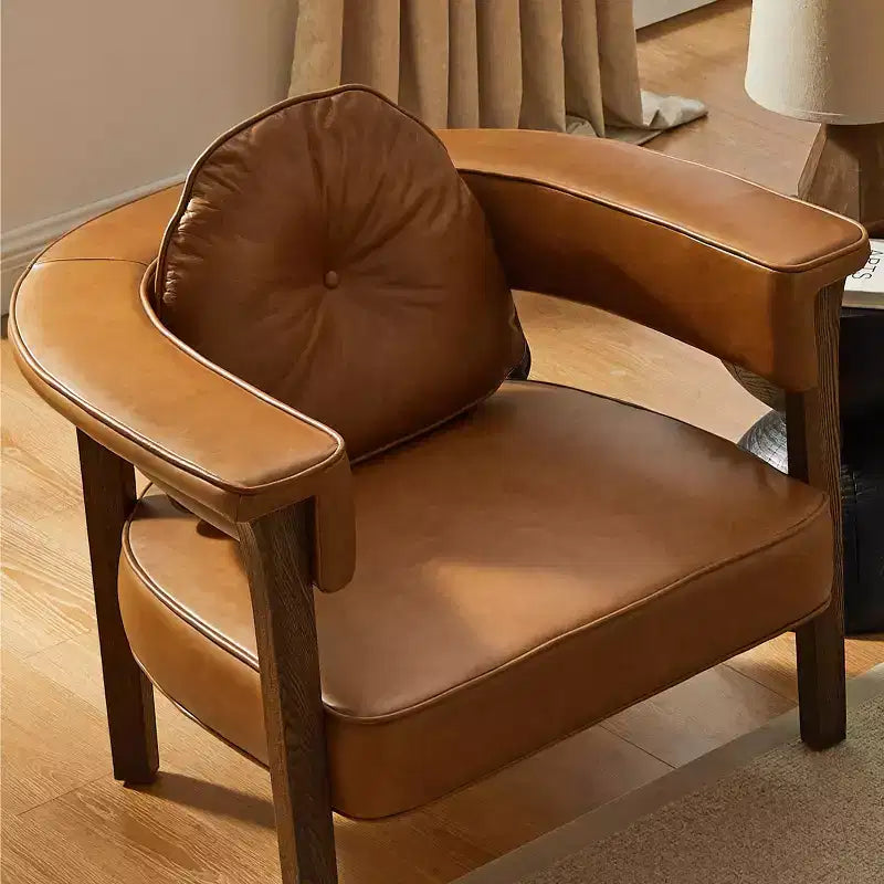 Sedia in pelle con telaio in legno di frassino