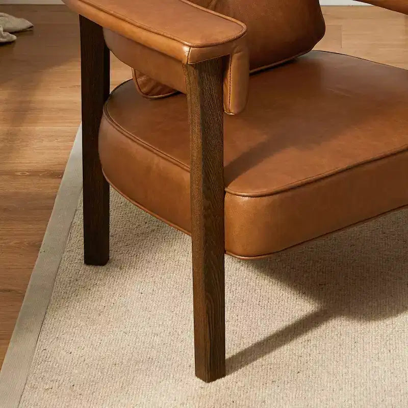 Sedia in pelle con telaio in legno di frassino