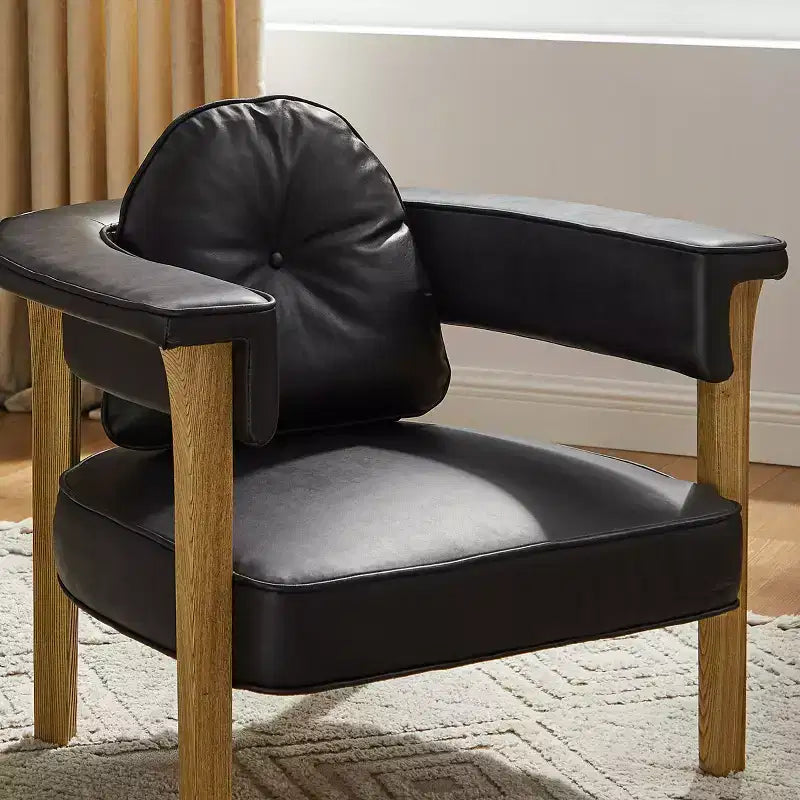 Sedia in pelle con telaio in legno di frassino